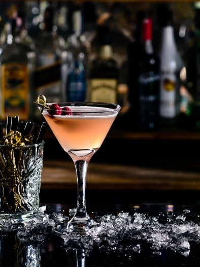 Ultimate Guide to Vodka Cocktails book cover featuring a refreshing vodka cocktail with lime, ice cubes in a sleek glass, set against a neutral marble background. The cover emphasizes the best vodka cocktail recipes for every occasion with bold red and black text.