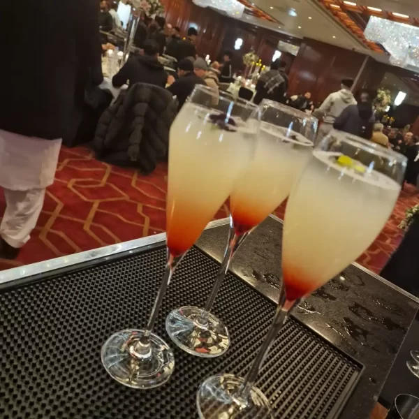 Three elegant cocktails at a social event.
